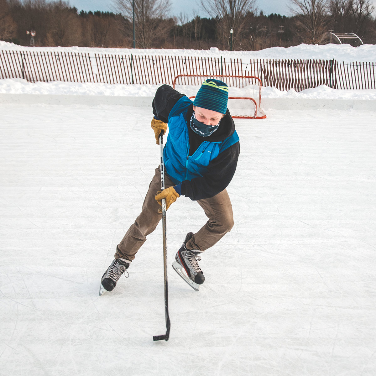 Person playing hockey outside