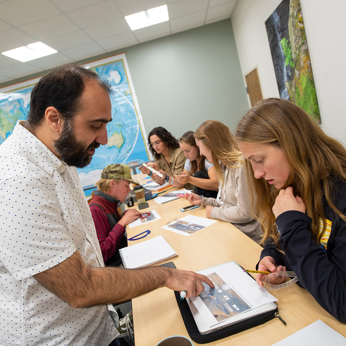 Faculty member working with students