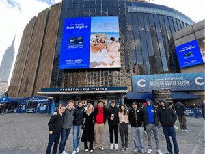 A group of Saint Lawrence students stand in front of Madison Square Garden.