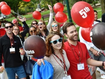 Alumni in a Reunion Parade with Balloons